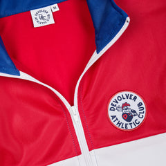 //merch.devolverdigital.co/cdn/shop/products/Trackie_Top_5---STORE_1024x1024.jpg?v=1659701388 DAC Track Top